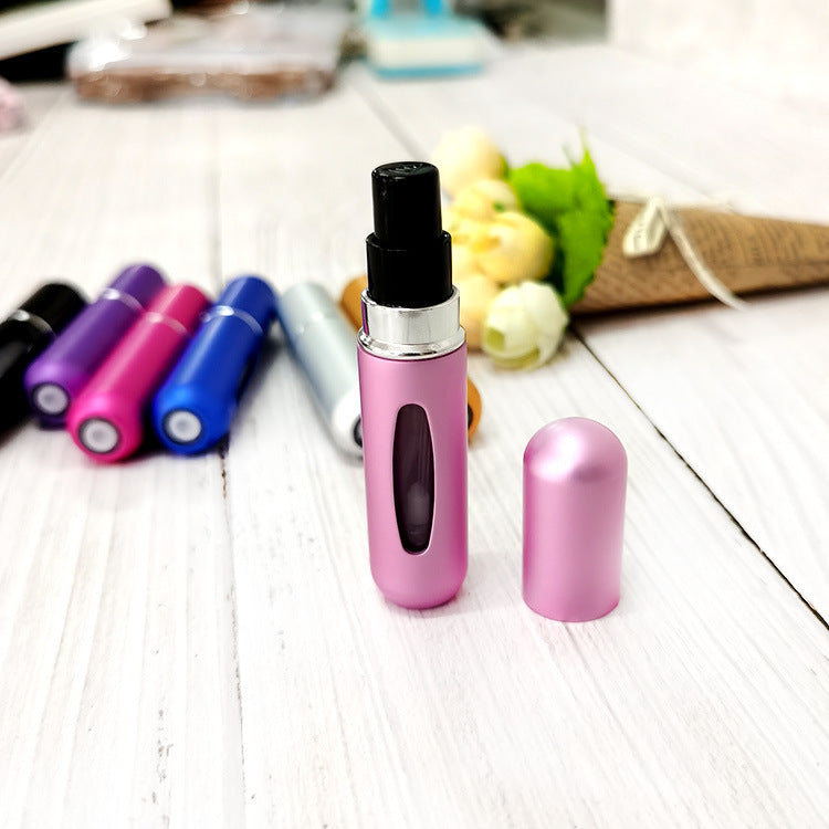Pink 5ml refillable perfume atomizer with cap removed